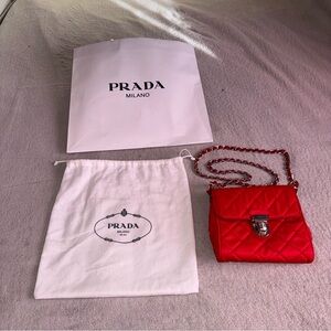 Prada quilted chain crossbody bag in red nylon and saffiano leather
